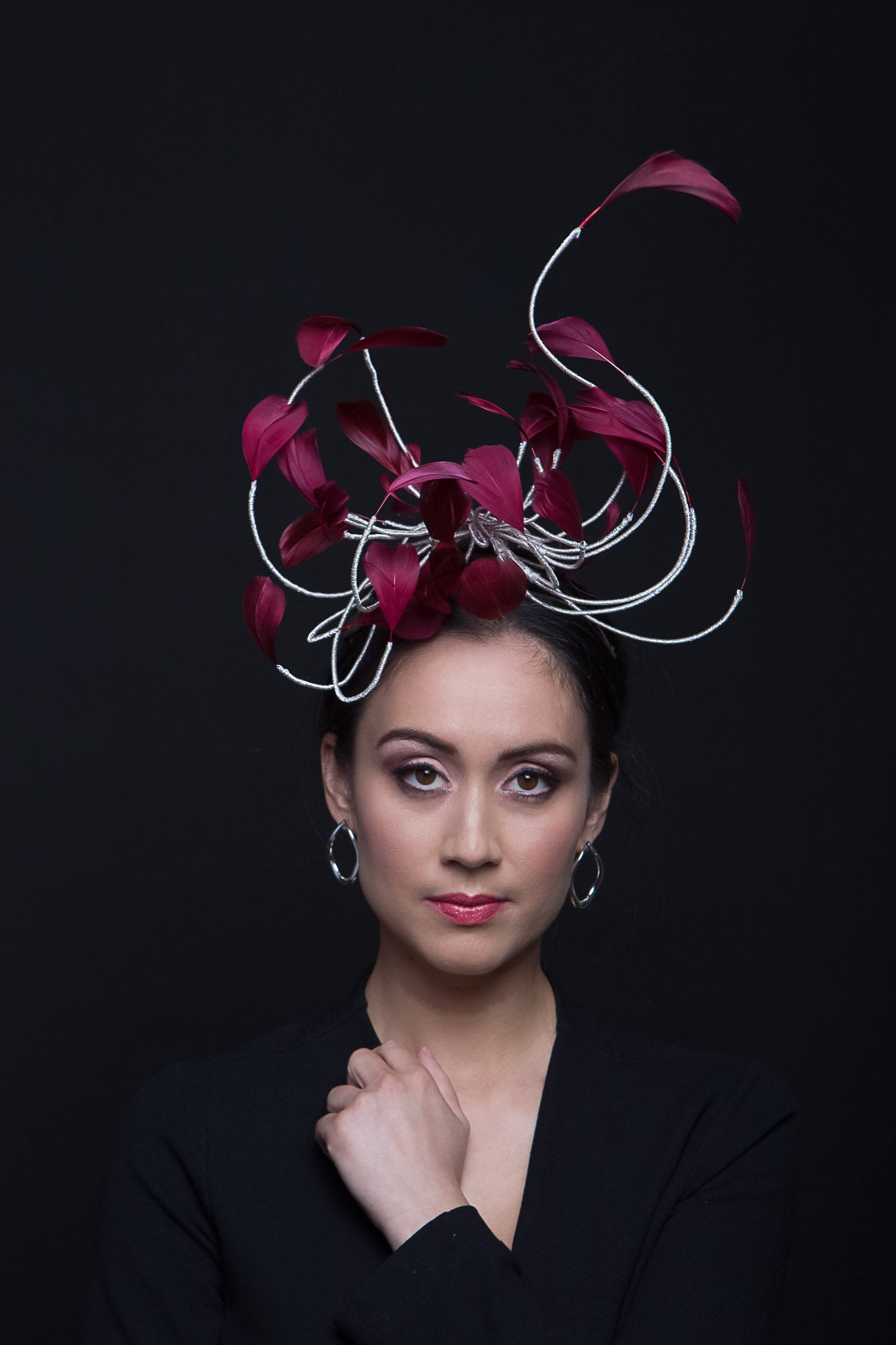 The Burgundy Floating Feather Swirl Flower is a cascade of floating feathers and silver highlight