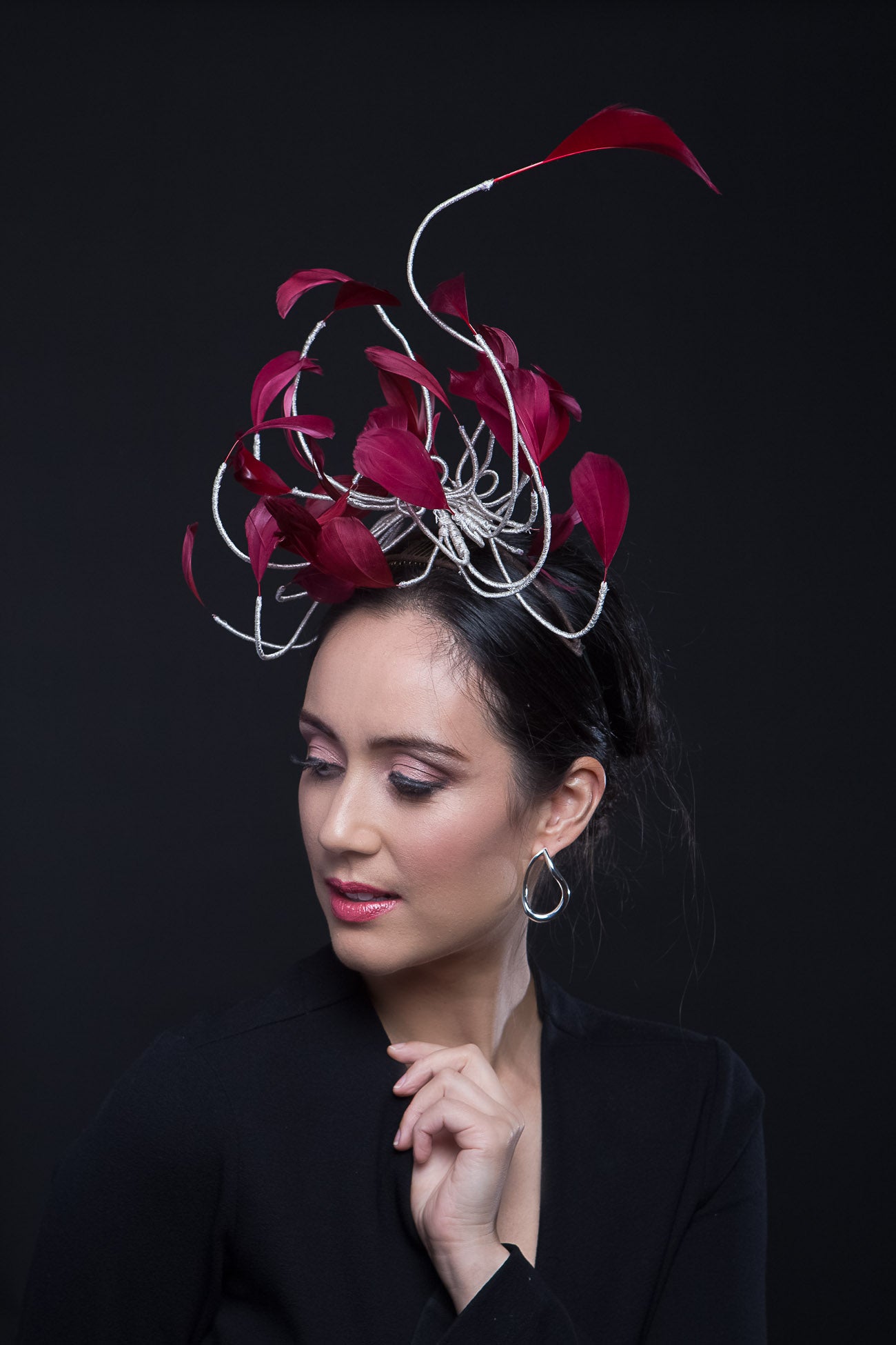 The Burgundy Floating Feather Swirl Flower is a cascade of floating feathers and silver highlight