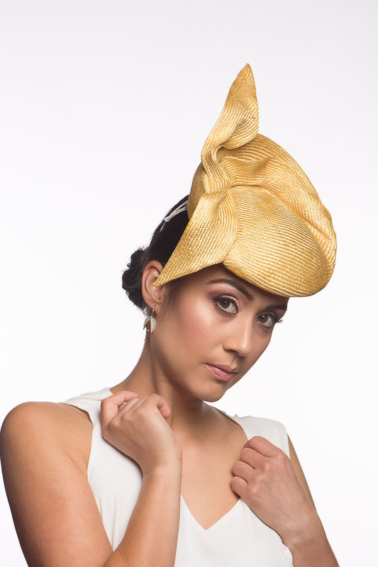 The Golden Yellow Sculptured Raised Beret features an extremely comfortable beret base. Trimmed with hand sculptured twists and folds within and around the beret