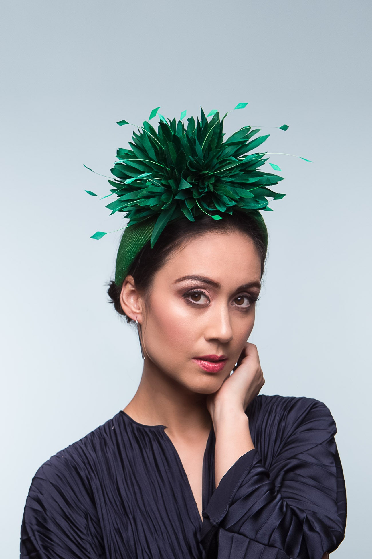 The Green Chrysanthemum Low Headband is a beautiful close fitting straw headband with pom pom chrysanthemums. Green is the colour of the season