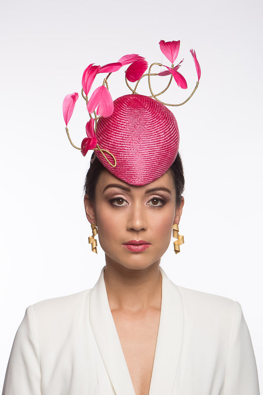 Hot Pink Beret with Floating Feathers is a straw beret and is designed to be worn at the centre of the forehead.