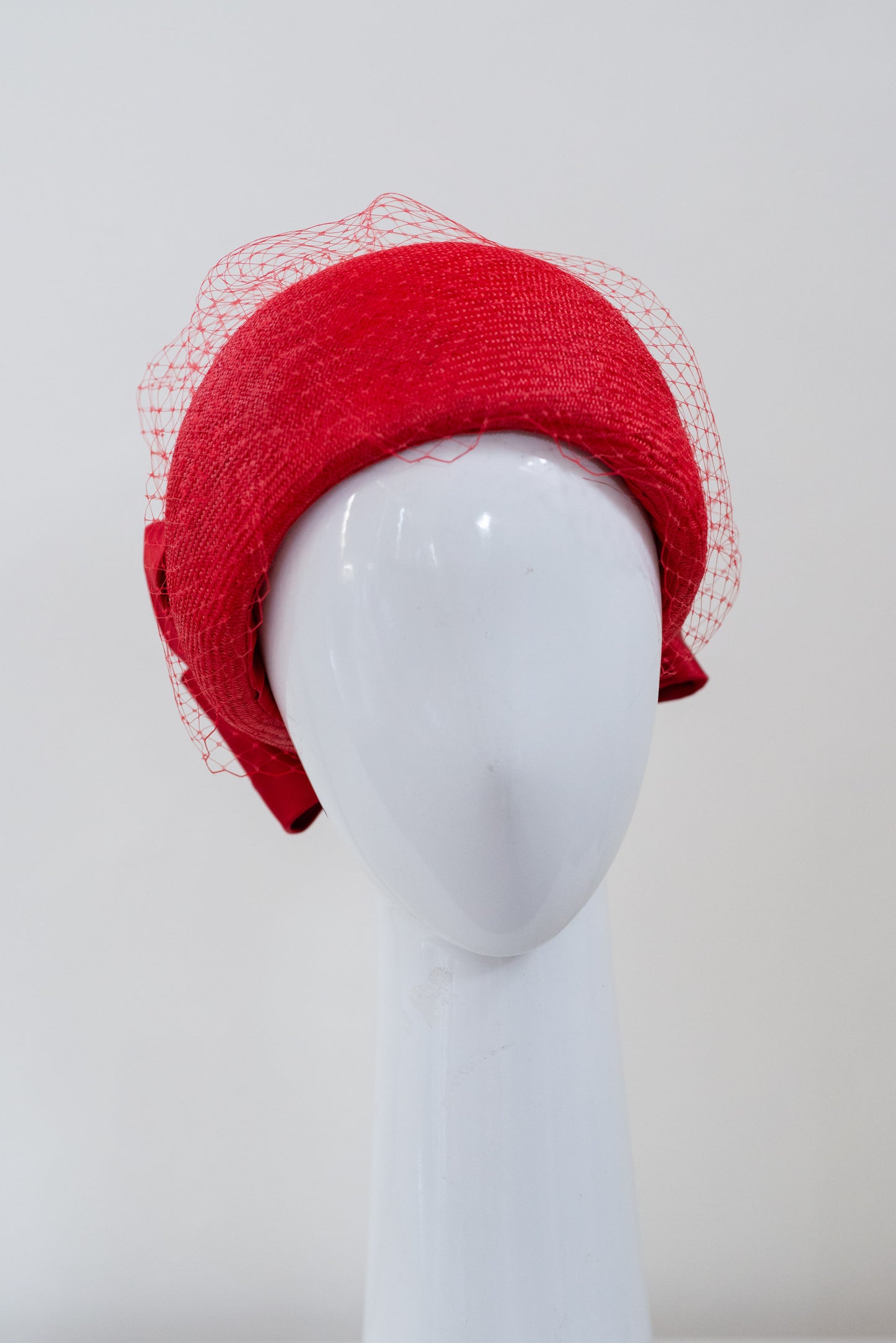 Red Pillbox with Silk Bow and Veiling by Felicity Northeast Millinery