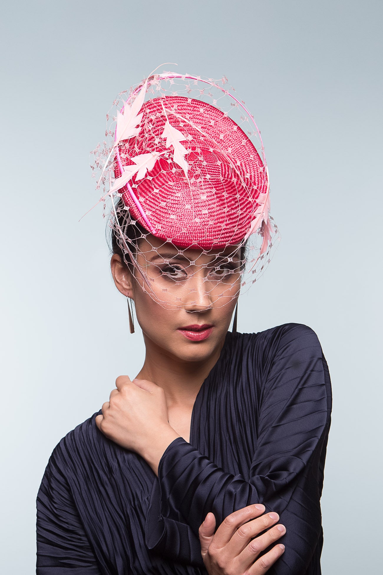 The Two-Toned Pink Raised Beret with Floating Feathers is an extremely comfortable beret base, trimmed with curved quills floating feathered leaves and a , fine vintage veiling.