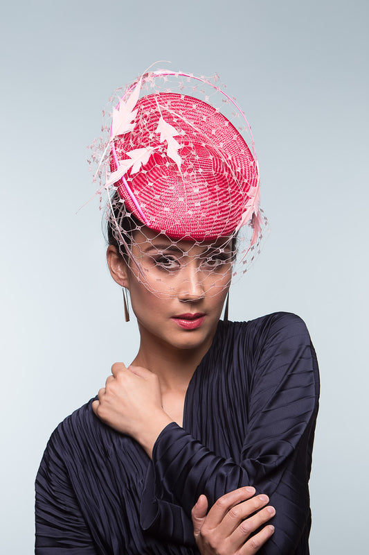 The Two-Toned Pink Raised Beret with Floating Feathers is an extremely comfortable beret base, trimmed with curved quills floating feathered leaves and a , fine vintage veiling.