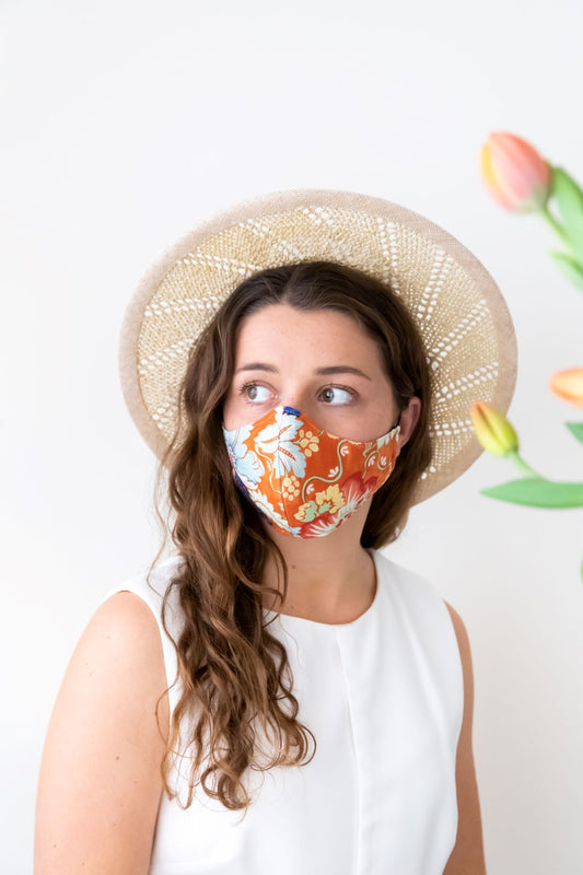 Open weave natural and cream boater, worn at the back by felicity Northeast Millinery