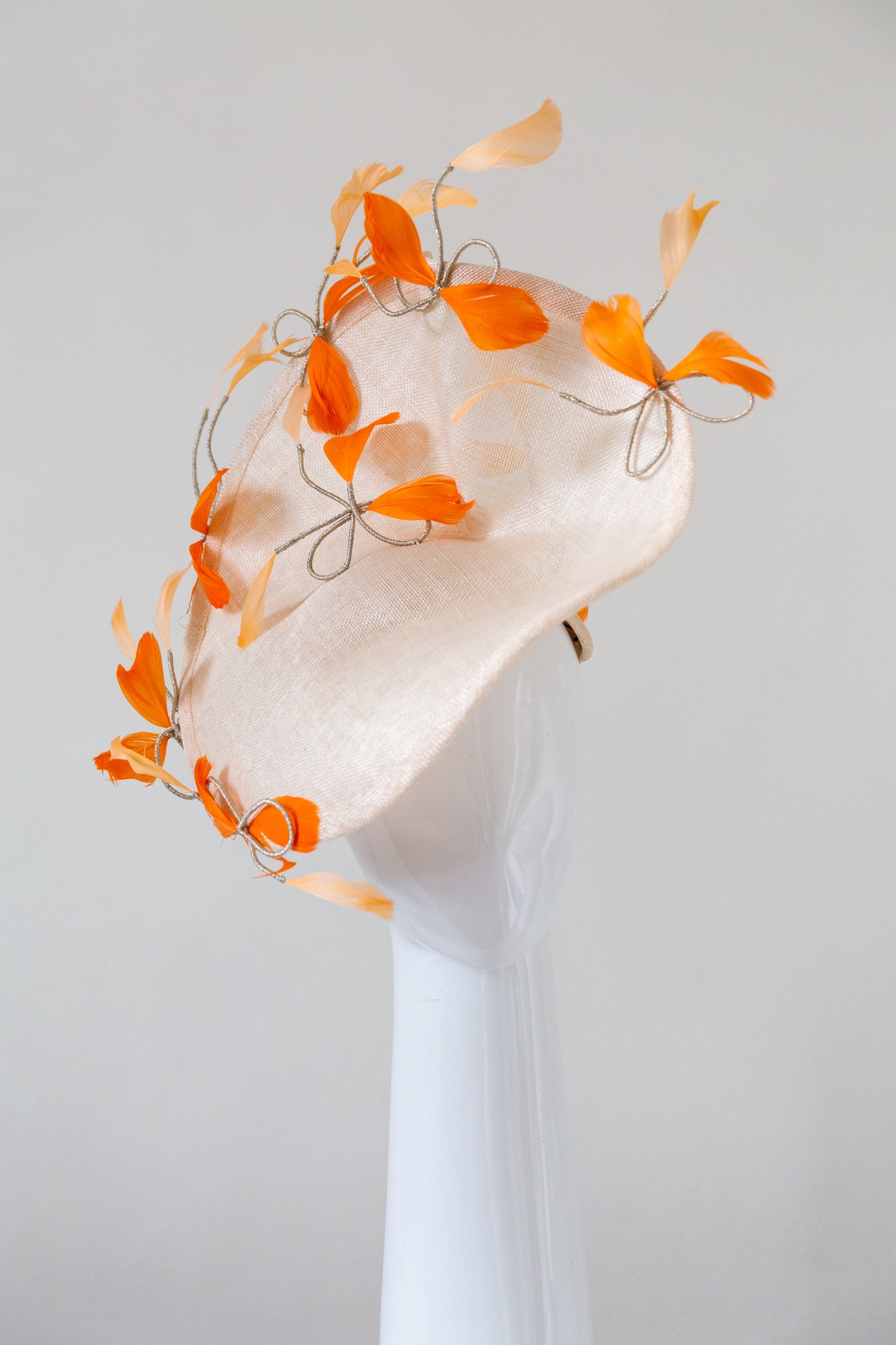 Sweeping Natural Platter with Orange Feathered Bows by Felicity Northeast Milliner