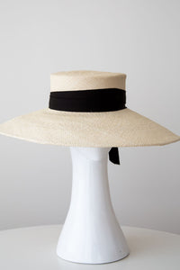 Wide brimmed cream panama sunhat with black ribbon ties