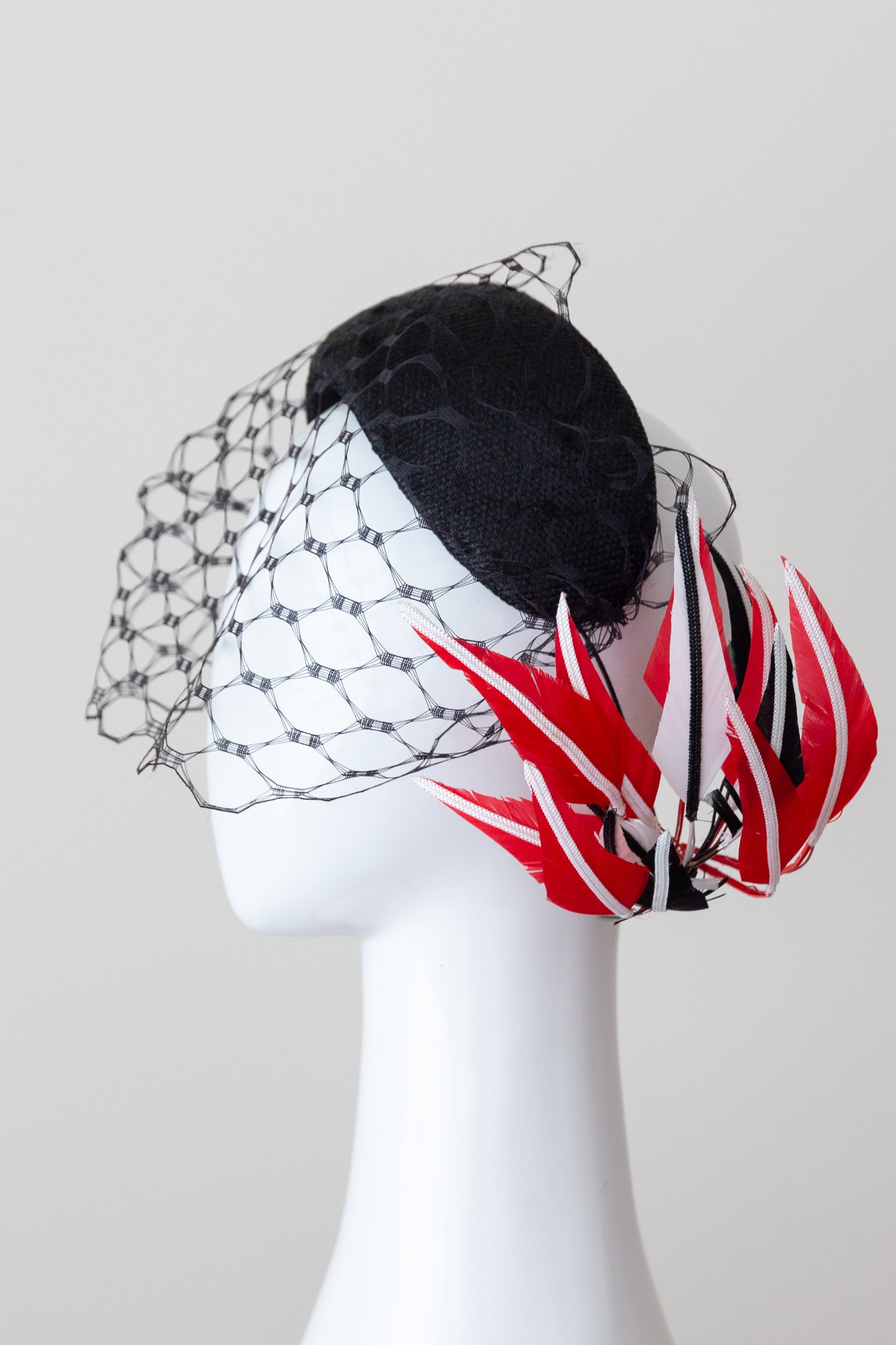 Wide Black Headband with Sweeping Back Feathers - Black, red and white  veiled headband, with back feather details by Felicity Northeast Millinery