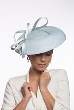 Load image into Gallery viewer, The Baby Blue Platter Hat with Sweeping Bows features a wide Dior brim with a shallow asymmetrical crown. Trimmed with lux satin silk bows on and under the brim