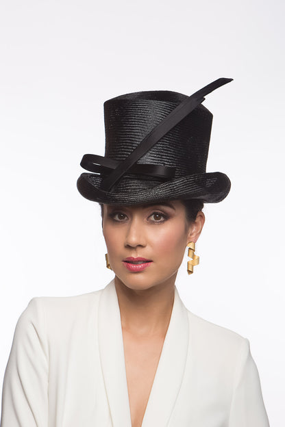 The Classic Black Top Hat features a curved top hat, trimmed with lux silk satin bow