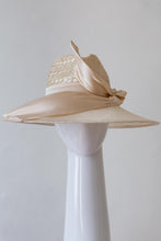 Load image into Gallery viewer, The Cream Fedora with Silk Trim is a modern fedora with a patterned straw crown and slightly curved wide brim