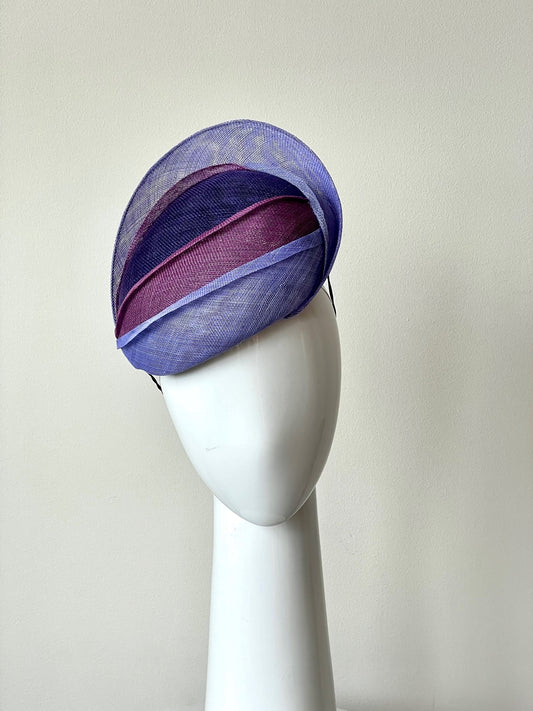 The Shades of Purple Beret style is a beautiful, tiered beret. Different shades of purple and mauve are layered across the beret, adding texture and height