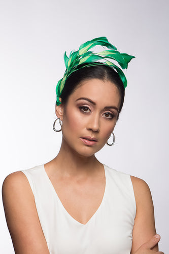 The Floating Two-Toned Green Feathered Headband features sweeping feathers in grass green which are inlaid with soft lime green highlights.