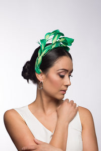 The Floating Two-Toned Green Feathered Headband features sweeping feathers in grass green which are inlaid with soft lime green highlights.