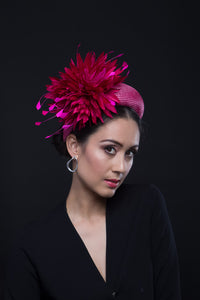 The Hot Pink Chrysanthemum Halo Headband is a raised straw headband with pom pom chrysanthemums.