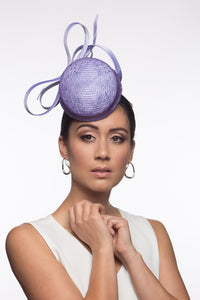 The Lilac Button Percher Hat features a raised button hat trimmed with silk satin stylised double bows which look beautiful from every angl