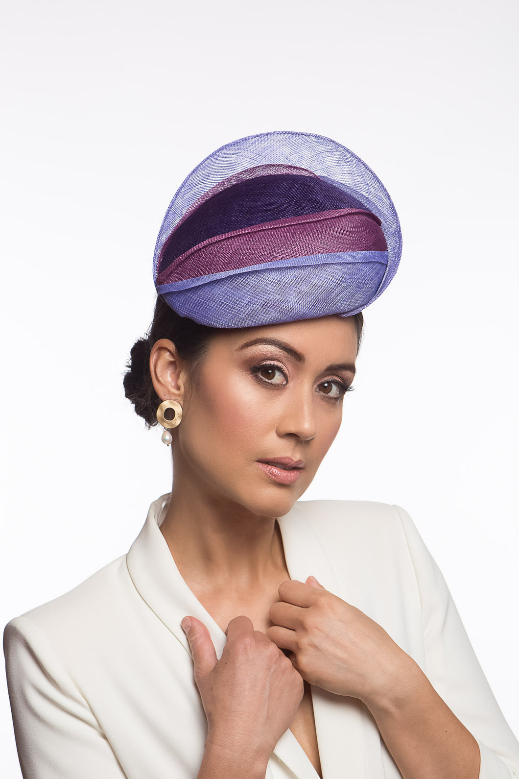 The Shades of Purple Beret style is a beautiful, tiered beret. Different shades of purple and mauve are layered across the beret, adding texture and height