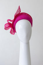 Load image into Gallery viewer, The Hot Pink Halo Headband with Floating Bow features a parisisal straw headband trimmed with a sinamay edge and a gorgeous floating bow which adds lightness and height
