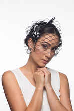 Load image into Gallery viewer, The Veiled Feather Leaf Headband in Black and White features a birdcage veil adorned with feather leave