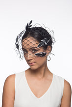 Load image into Gallery viewer, The Veiled Feather Leaf Headband in Black and White features a birdcage veil adorned with feather leave