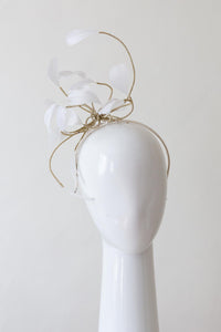White Floating Feather Headpiece by Felicity Northeast Millinery is a gorgeous headband with cascading white feathers and light gold highlights.