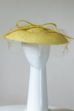 Load image into Gallery viewer, The Yellow Platter Hat with Bow and Veiling features a wide Dior brim with a shallow crown. Trimmed with a lux satin silk bow on across the brim and draped in a fine vintage veiling