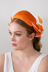 Orange bandeau with sweeping back feathers by Felicity Northeast Millinery