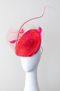ALEX- Platter hat in hot pink and red with veiling and feathers