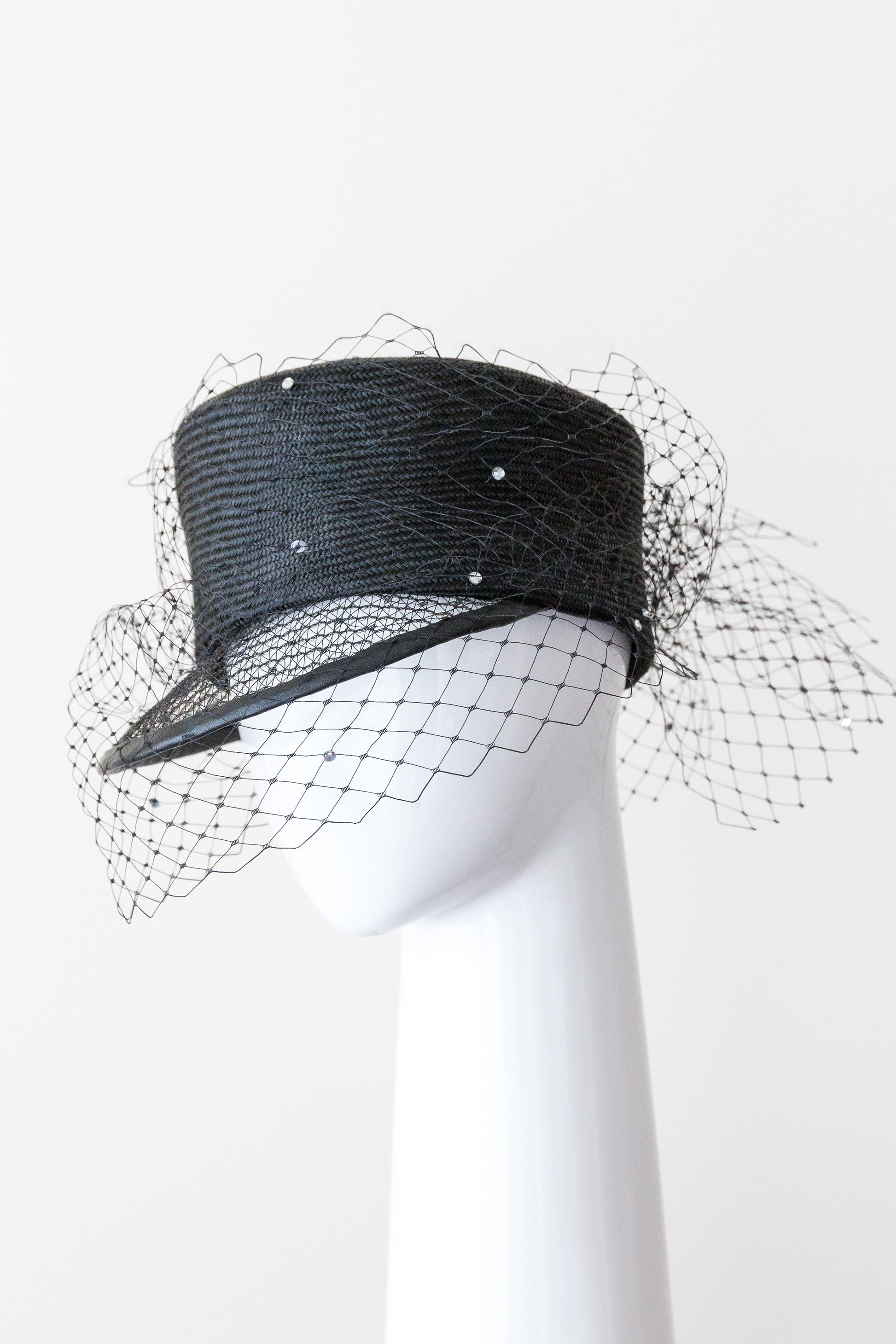 ANNA- Black cap with open weave visor and diamante veiling