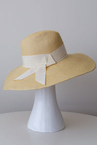 Natural panama fedora with soft brim and wide cream grosgrain ribbon, side view
