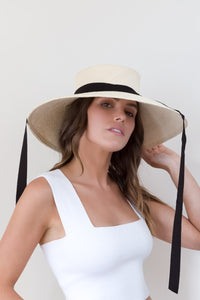 Wide brimmed cream panama sunhat with black ribbon ties
