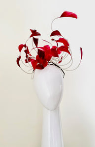The Burgundy Floating Feather Swirl Flower is a cascade of floating feathers and silver highlight