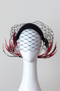 Wide Black Headband with Sweeping Back Feathers -Black, red and white veiled headband with back feather details by Felicity Northeast Millinery